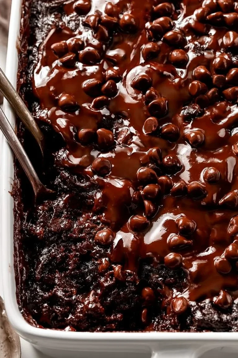 Decadent homemade Chocolate Dump Cake topped with chocolate frosting