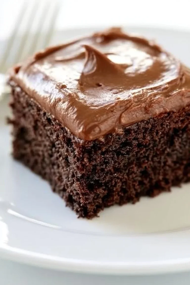 Deliciously moist easy chocolate cake topped with chocolate frosting