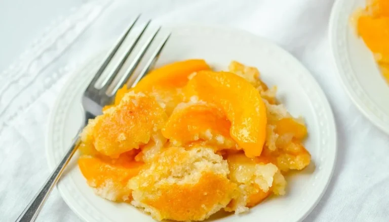 Freshly baked gluten-free peach cobbler topped with a golden crust