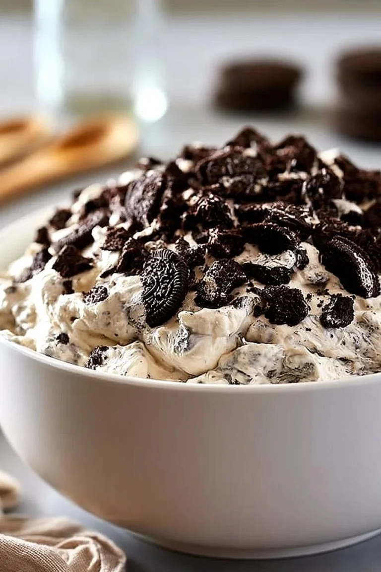 Deliciously creamy Oreo Mousse dessert in a glass garnished with crushed Oreos